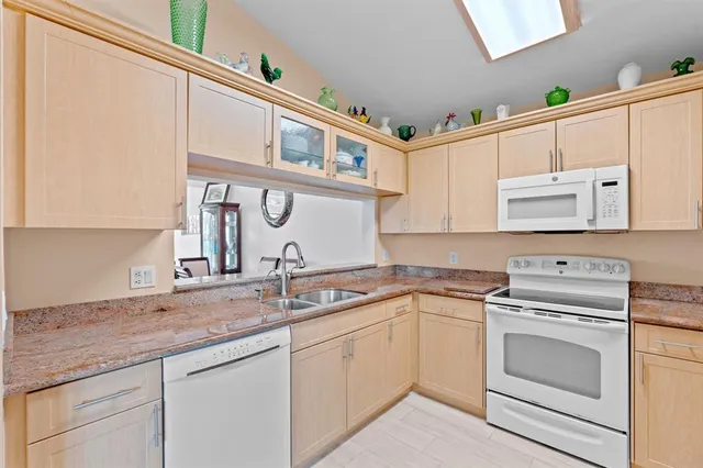 an aerial view of a residential houses with outdoor space swimming pool and outdoor seating