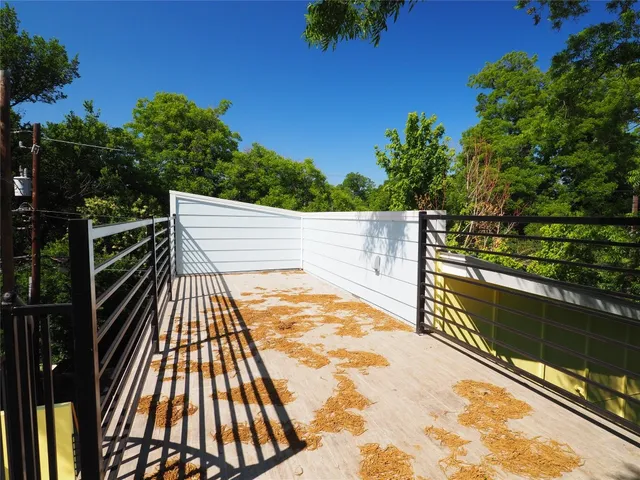 a view of a balcony with wooden floor
