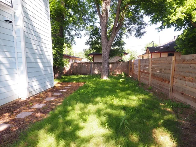 a bathroom with a shower and a sink
