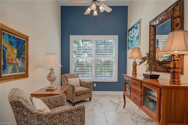 a bedroom with a bed and a tv on the dresser