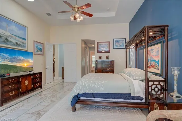 a bedroom with a bed and dresser