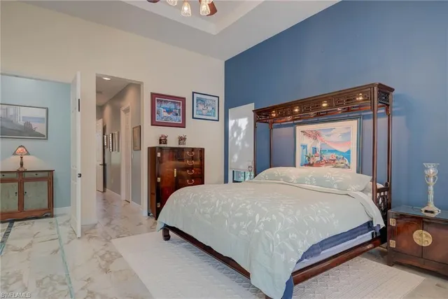 a bathroom with a toilet a sink and a mirror