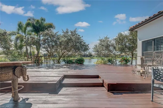 a view of a chair and tables in the patio