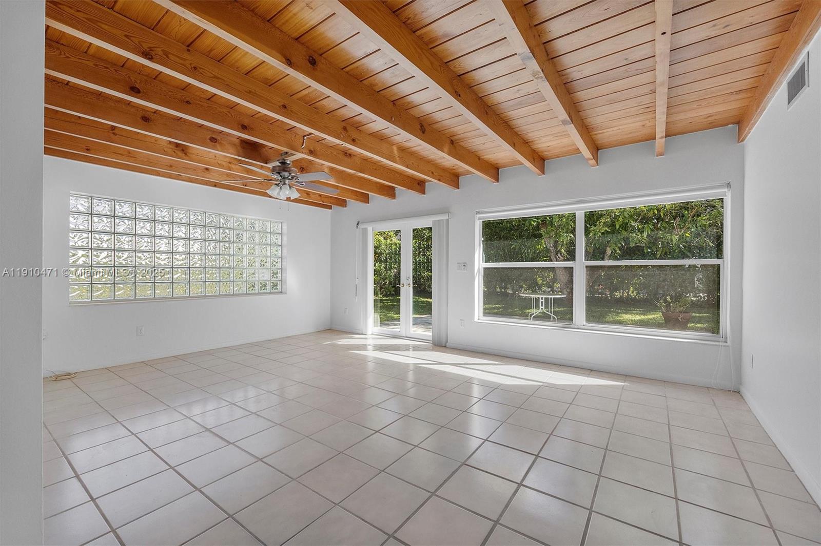 11111 Southwest 78th Court Pinecrest, FL 33156 - Photo 11 of 36 a view of an empty room with windows