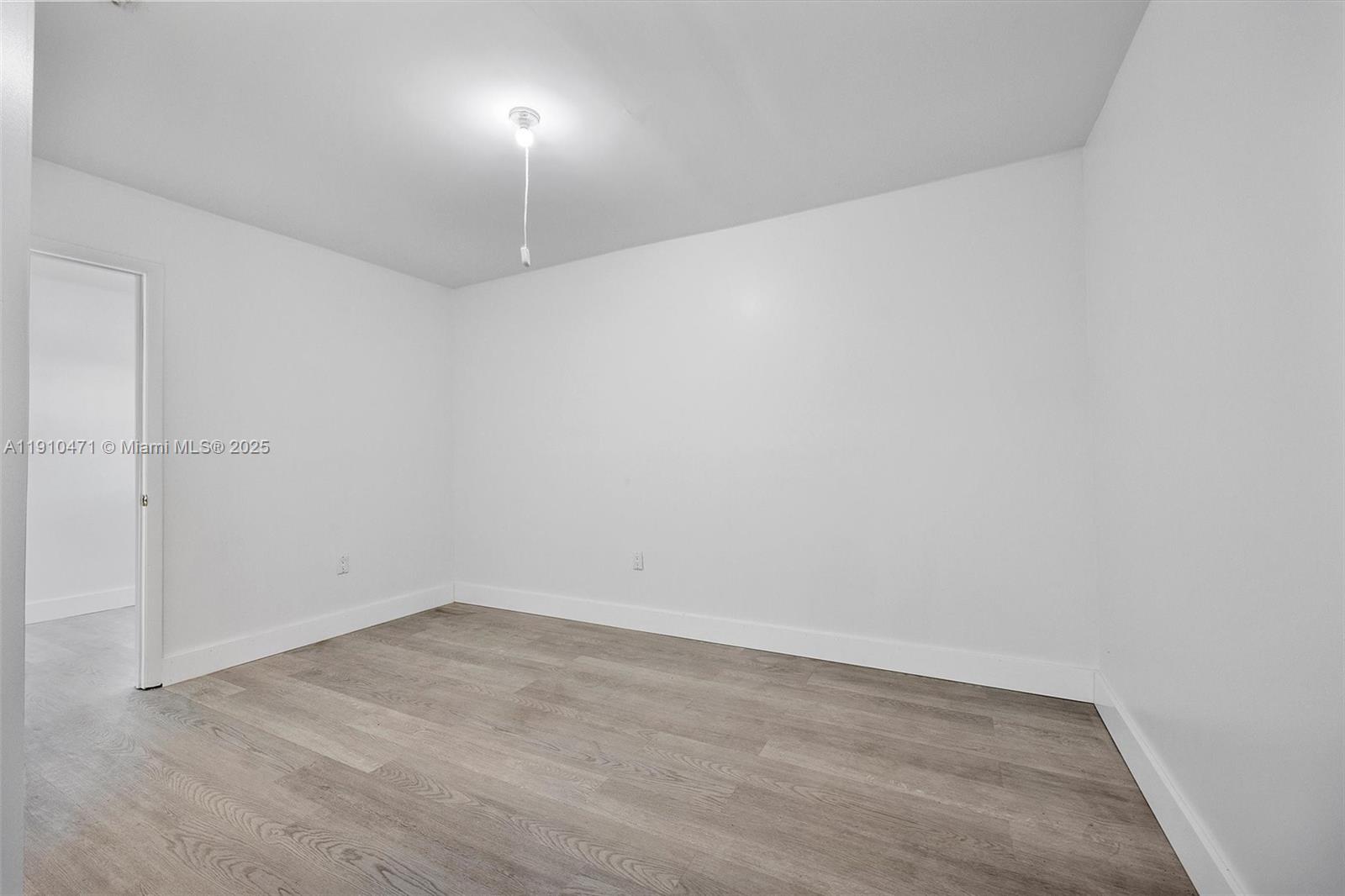 11111 Southwest 78th Court Pinecrest, FL 33156 - Photo 14 of 36 an empty room with a workbench