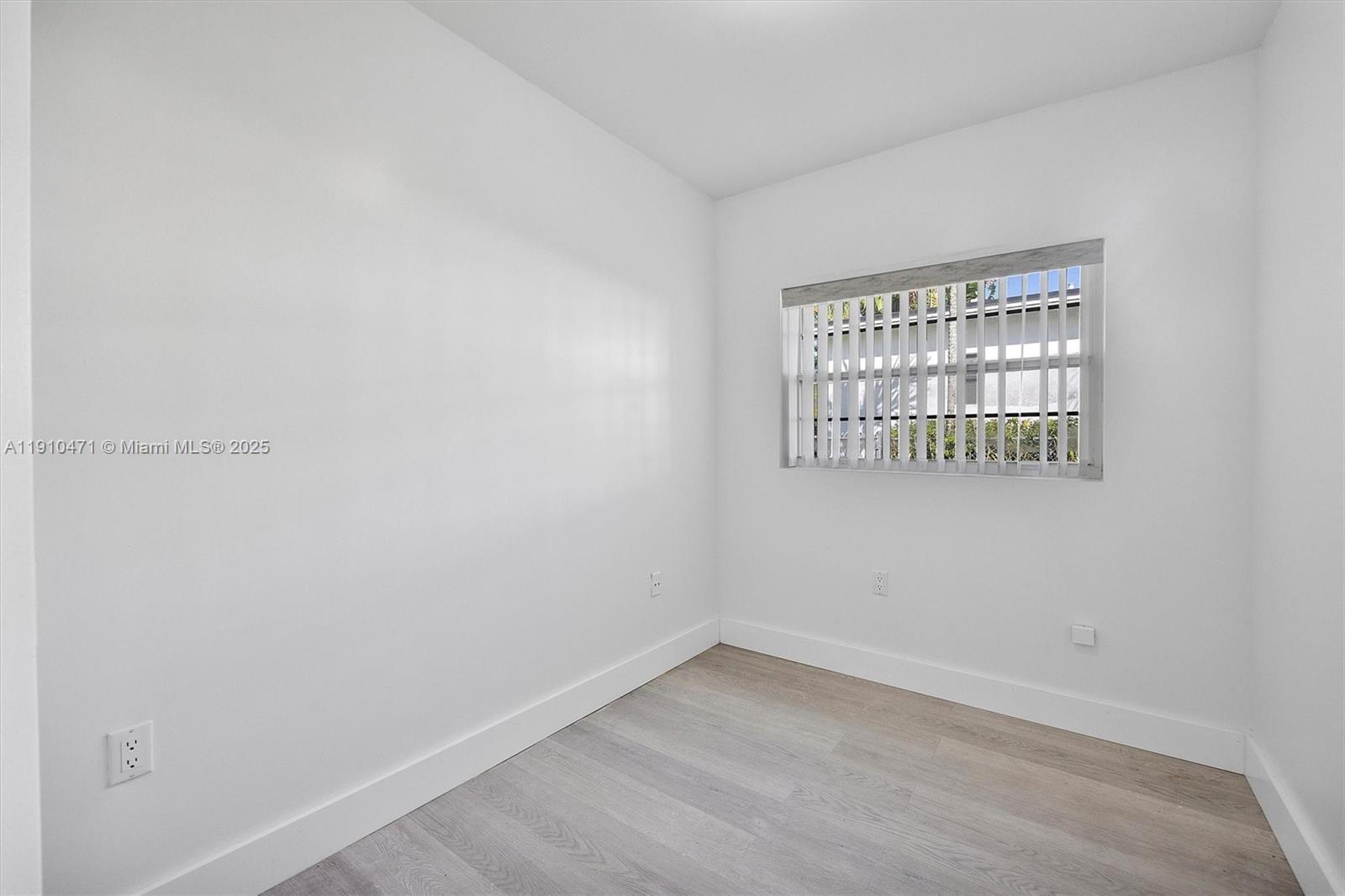 11111 Southwest 78th Court Pinecrest, FL 33156 - Photo 16 of 36 a view of an empty room with a window