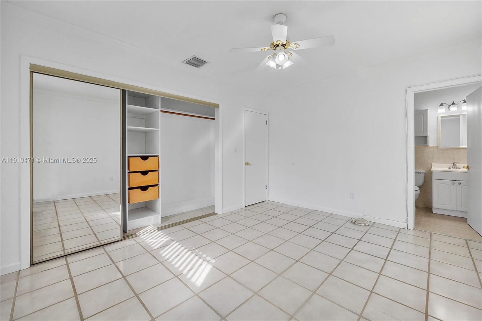 11111 Southwest 78th Court Pinecrest, FL 33156 - Photo 18 of 36 a view of an empty room and a bathroom