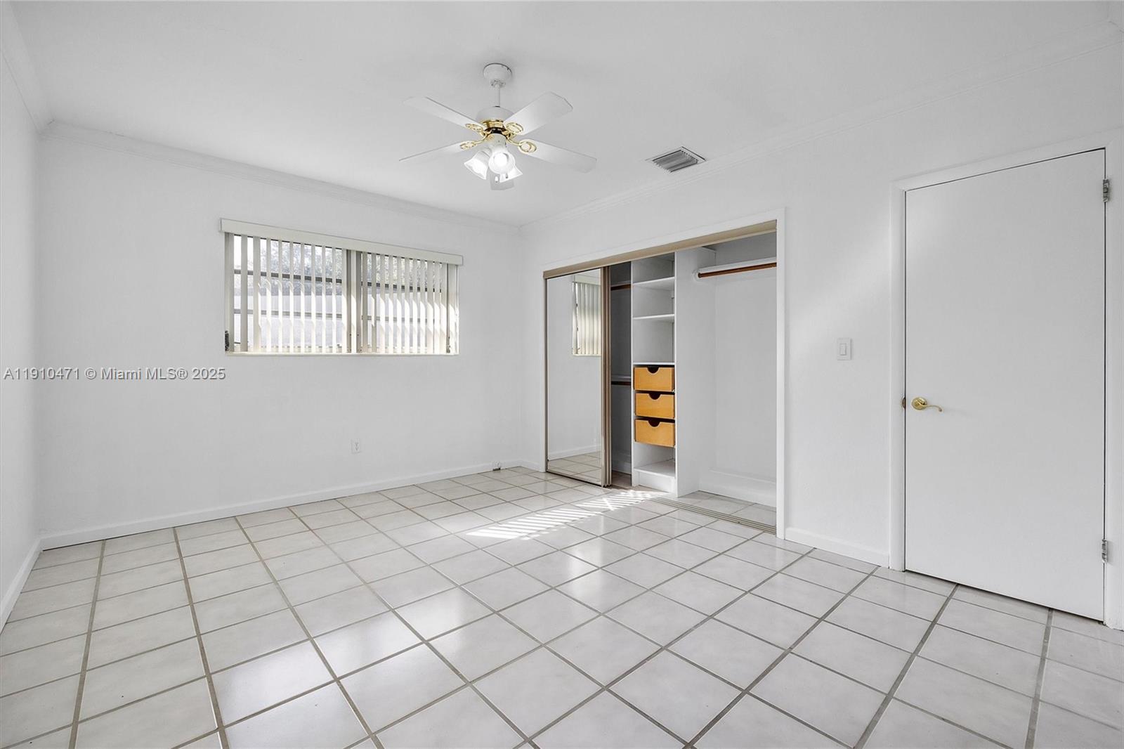 11111 Southwest 78th Court Pinecrest, FL 33156 - Photo 20 of 36 a view of an empty room with a window