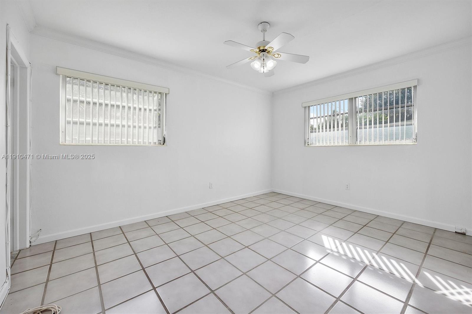 11111 Southwest 78th Court Pinecrest, FL 33156 - Photo 21 of 36 a view of an empty room with a window
