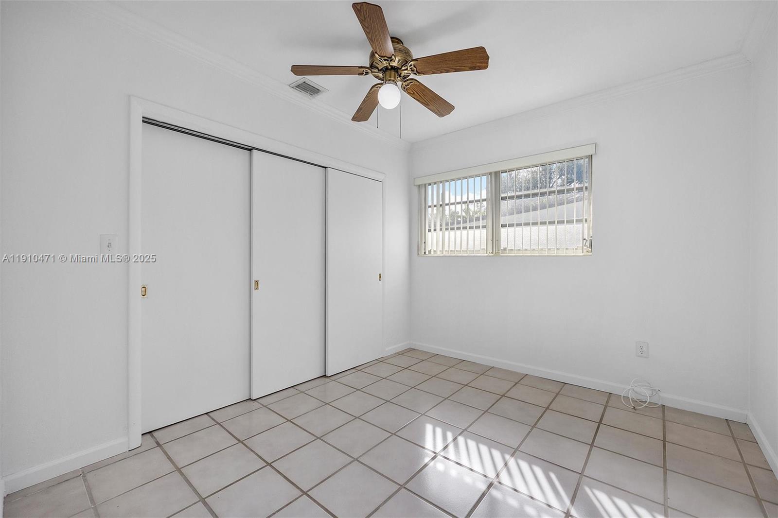 11111 Southwest 78th Court Pinecrest, FL 33156 - Photo 22 of 36 a view of an empty room with a window