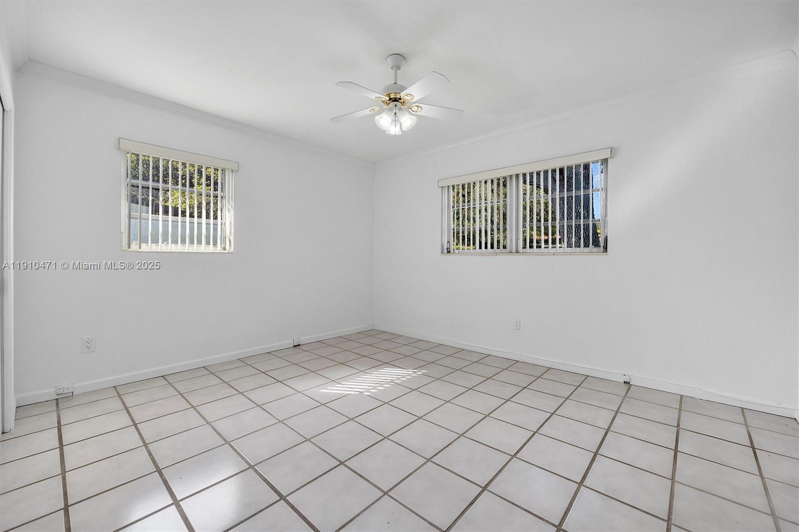 11111 Southwest 78th Court Pinecrest, FL 33156 - Photo 24 of 36 a view of an empty room and window