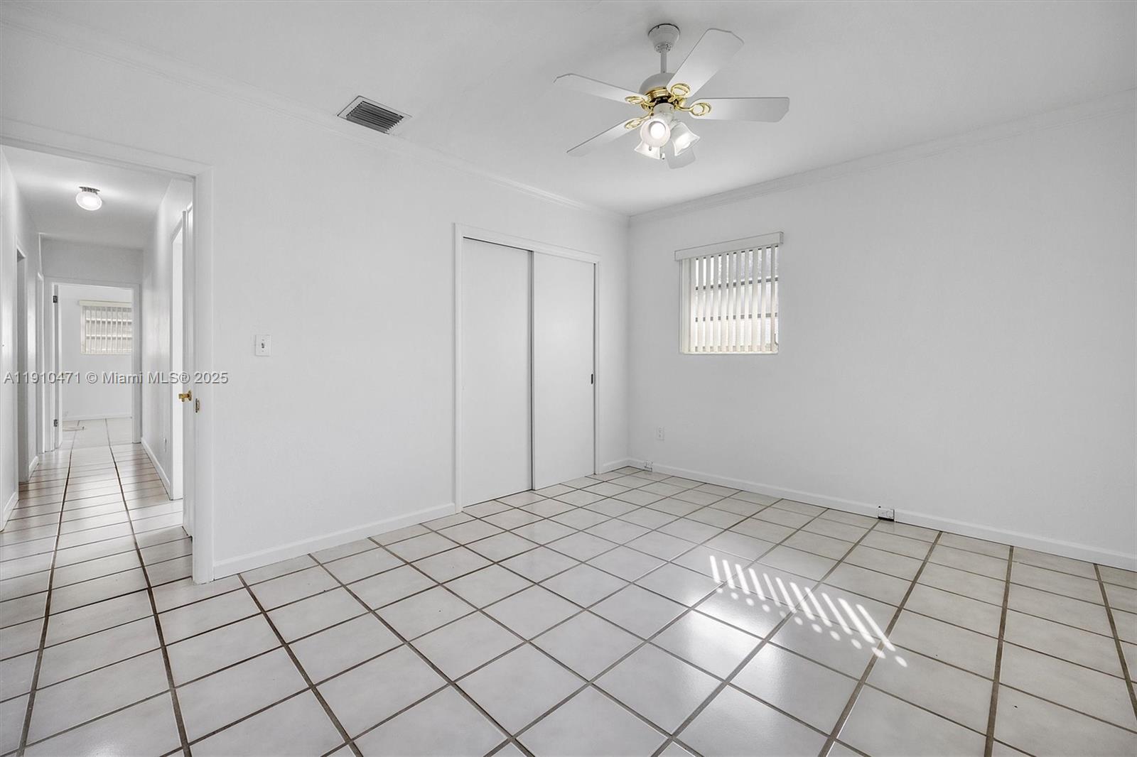 11111 Southwest 78th Court Pinecrest, FL 33156 - Photo 25 of 36 a view of an empty room and a bathroom