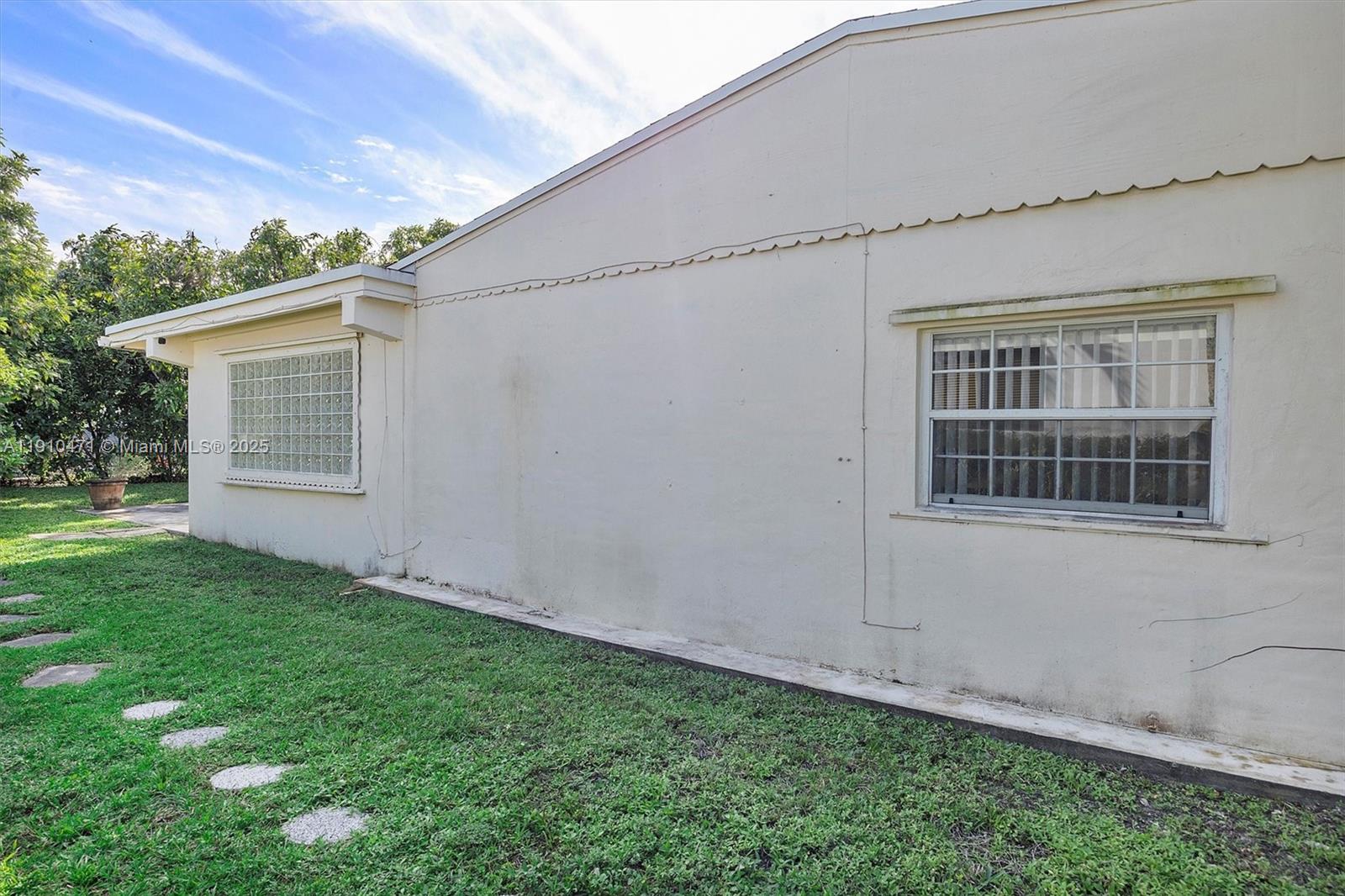 11111 Southwest 78th Court Pinecrest, FL 33156 - Photo 26 of 36 front view of a house with a yard