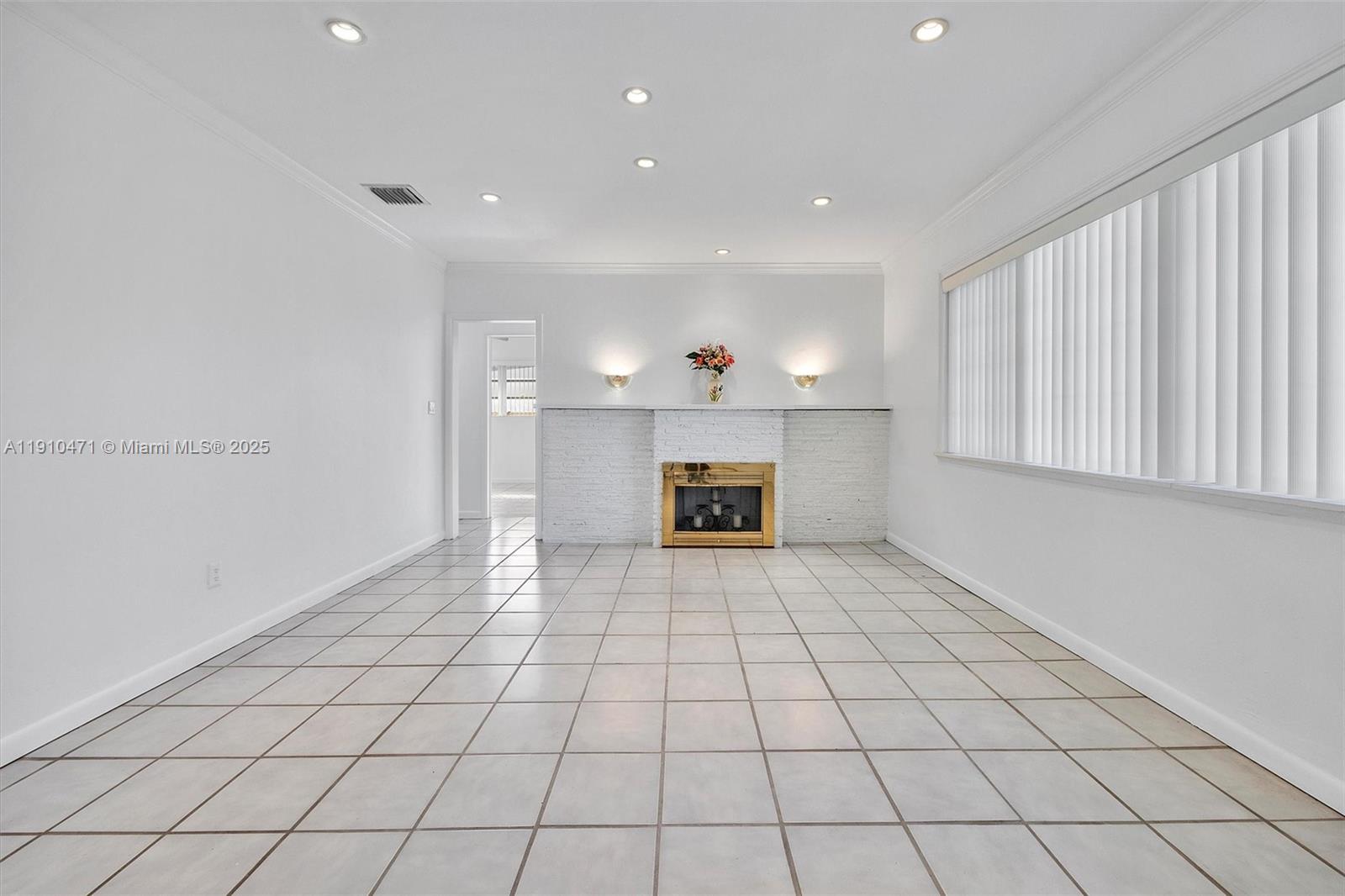 11111 Southwest 78th Court Pinecrest, FL 33156 - Photo 4 of 36 a view of an empty room with a window