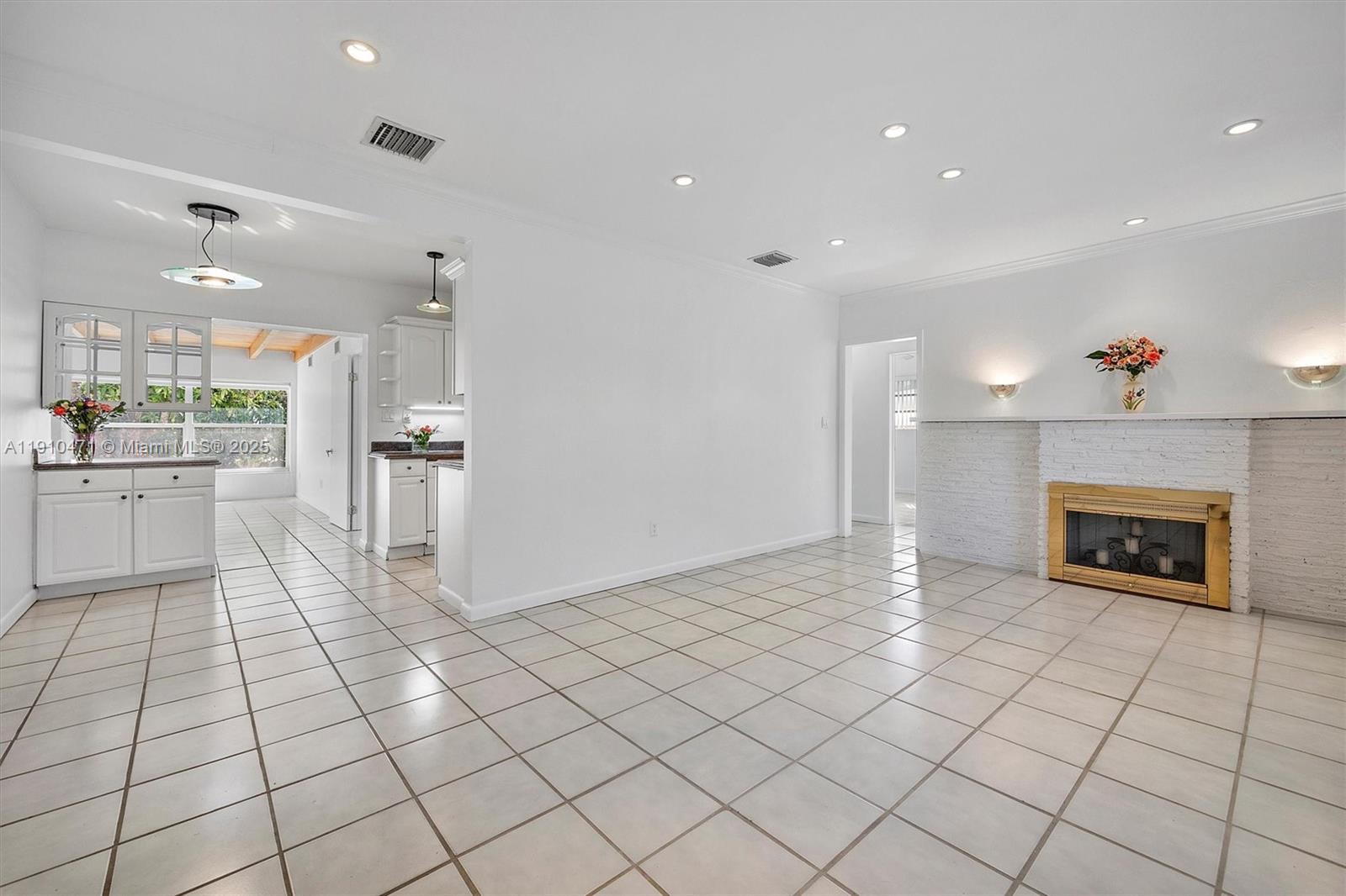 11111 Southwest 78th Court Pinecrest, FL 33156 - Photo 5 of 36 a view of a kitchen with furniture and an empty room