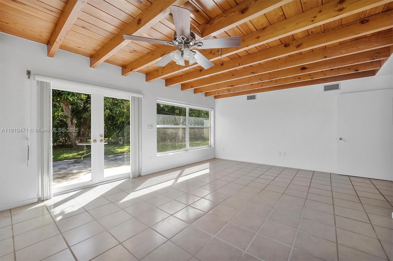 11111 Southwest 78th Court Pinecrest, FL 33156 - Photo 10 of 36 a view of an empty room with windows