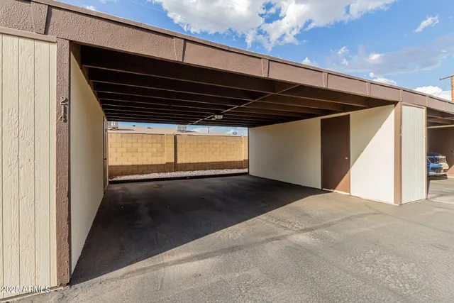 a view of a house with backyard and a tree