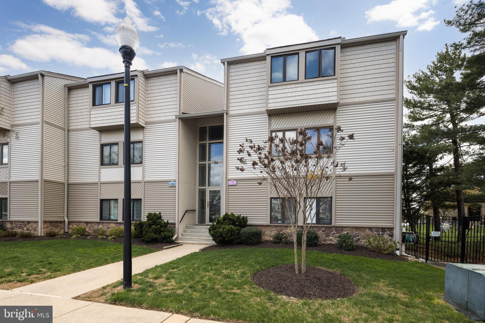 550 Riviera Drive, Unit 550B Joppa, MD 21085 - Photo 1 of 11 a front view of a house with a garden and plants