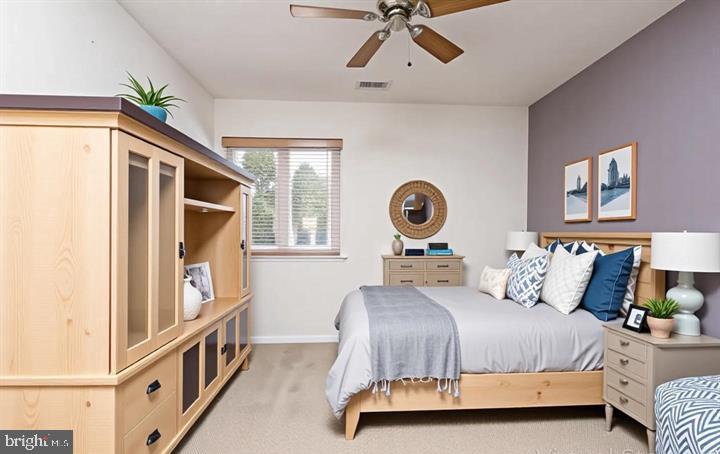 550 Riviera Drive, Unit 550B Joppa, MD 21085 - Photo 8 of 11 a bedroom with a bed and window