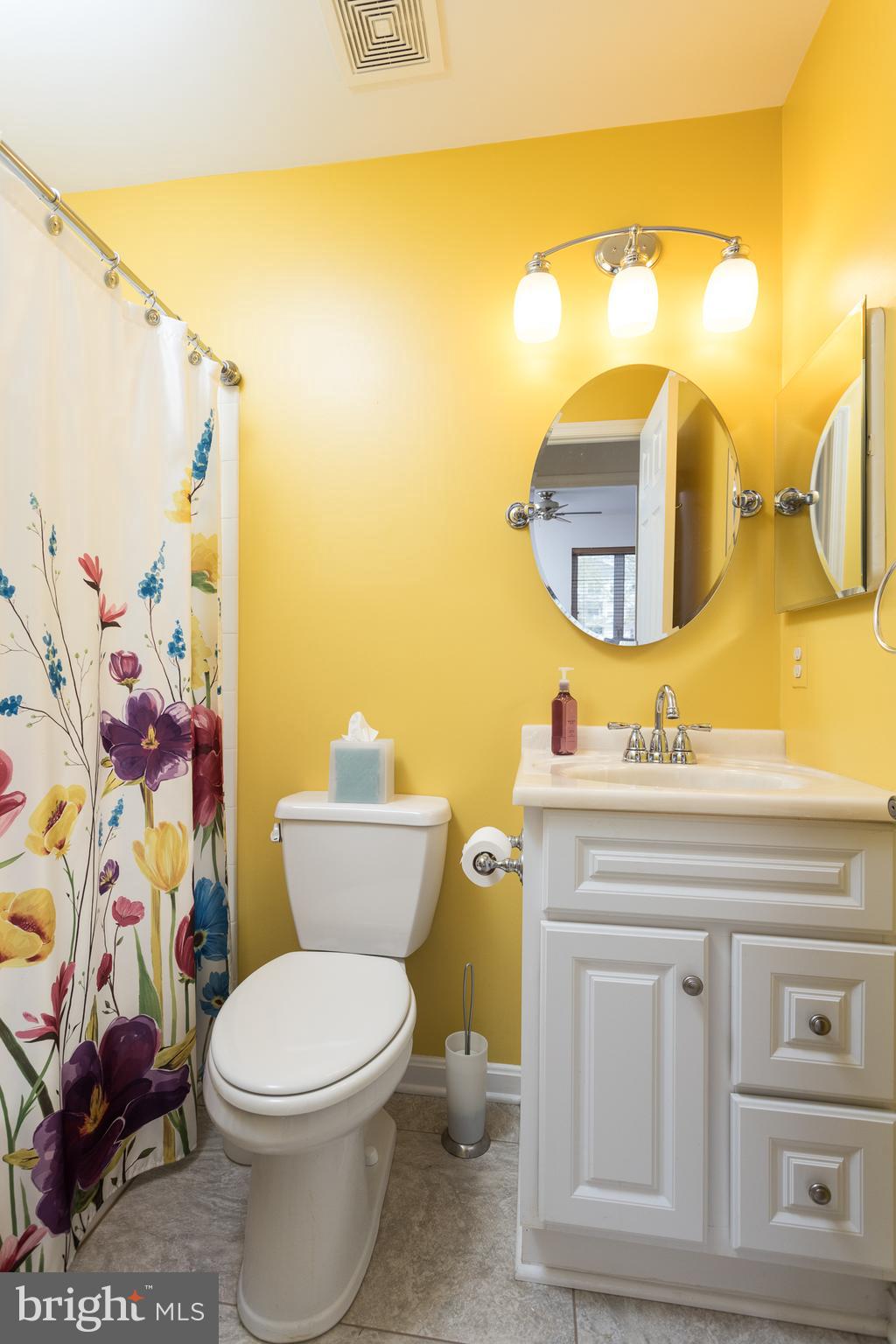 550 Riviera Drive, Unit 550B Joppa, MD 21085 - Photo 9 of 11 a bathroom with a toilet a sink and a mirror