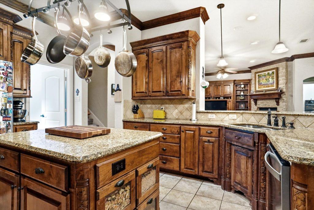 620 Highview Lane Hurst, TX 76054 - Photo 23 of 40 a kitchen with a stove and a sink