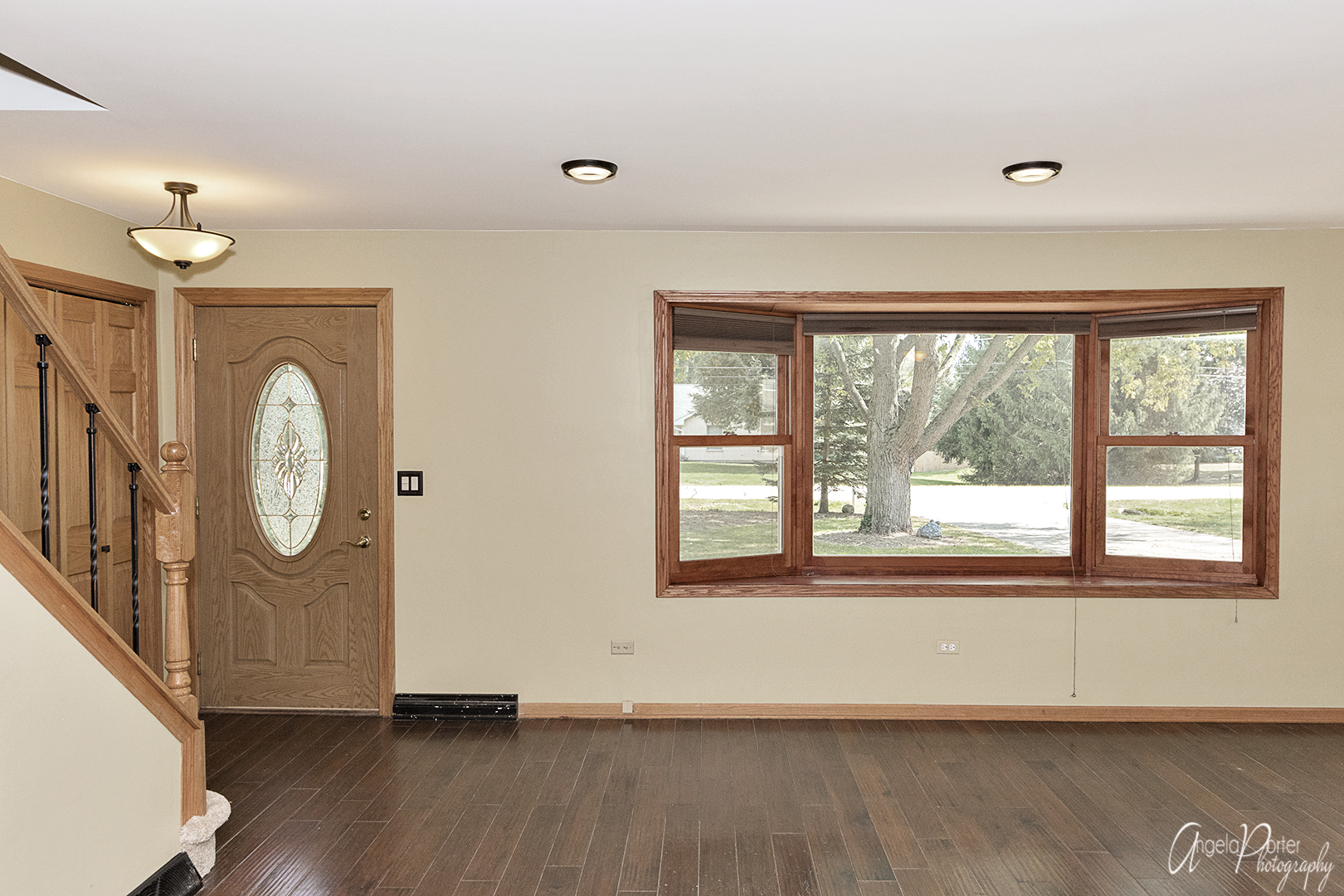 39240 North Winchester Road Wadsworth, IL 60083 - Photo 2 of 28 wooden floor in an empty room with a window
