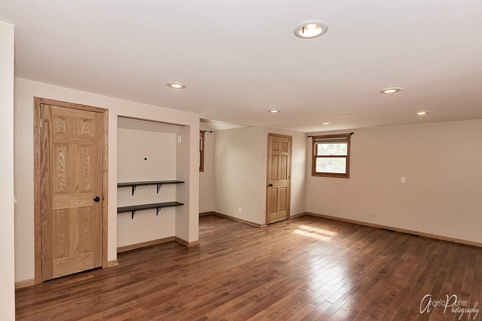 39240 North Winchester Road Wadsworth, IL 60083 - Photo 13 of 28 an empty room with wooden floor and empty shelves