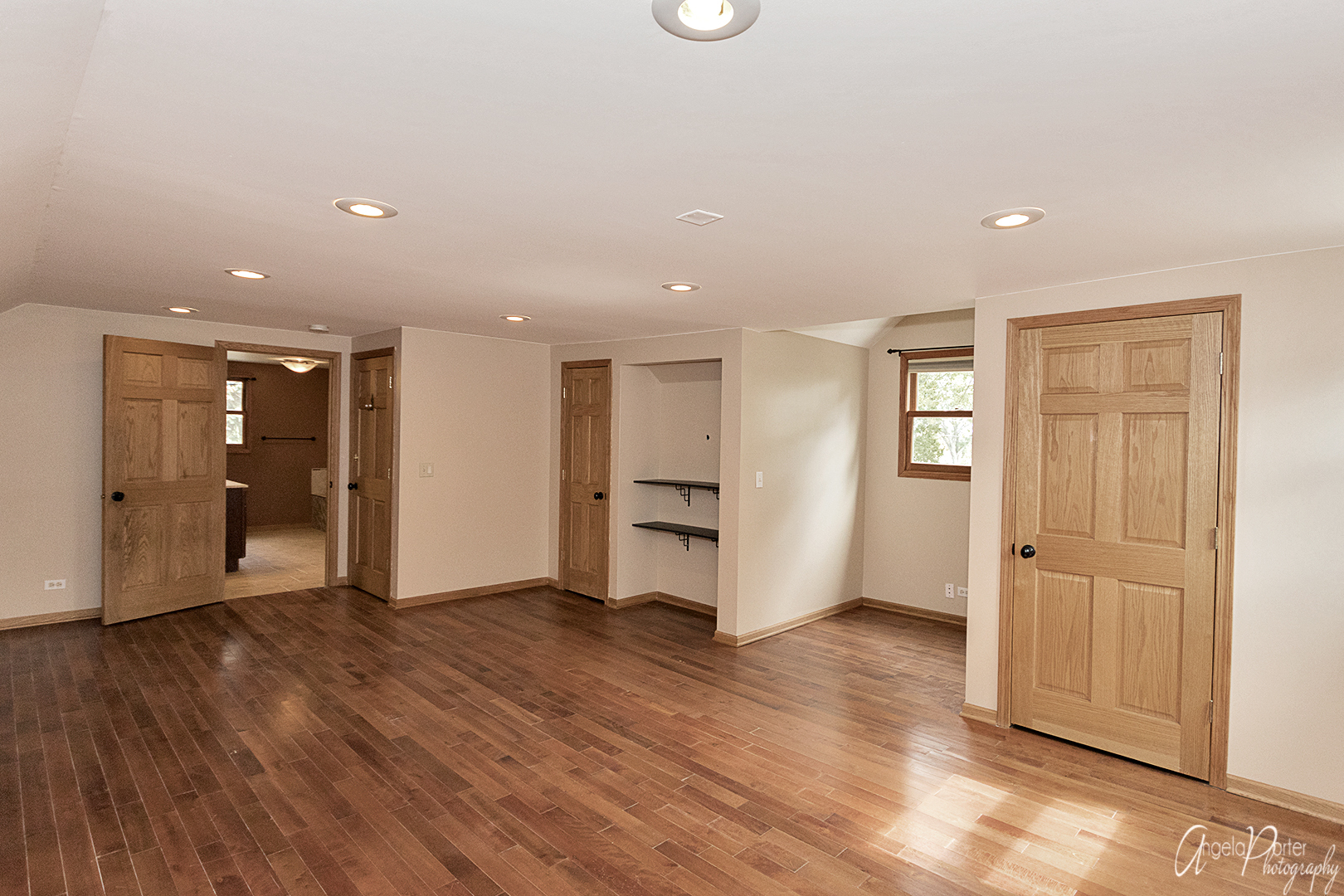 39240 North Winchester Road Wadsworth, IL 60083 - Photo 14 of 28 a view of an empty room with wooden floor and windows