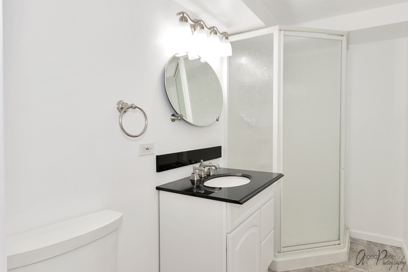 39240 North Winchester Road Wadsworth, IL 60083 - Photo 18 of 28 a bathroom with a sink a toilet and a mirror