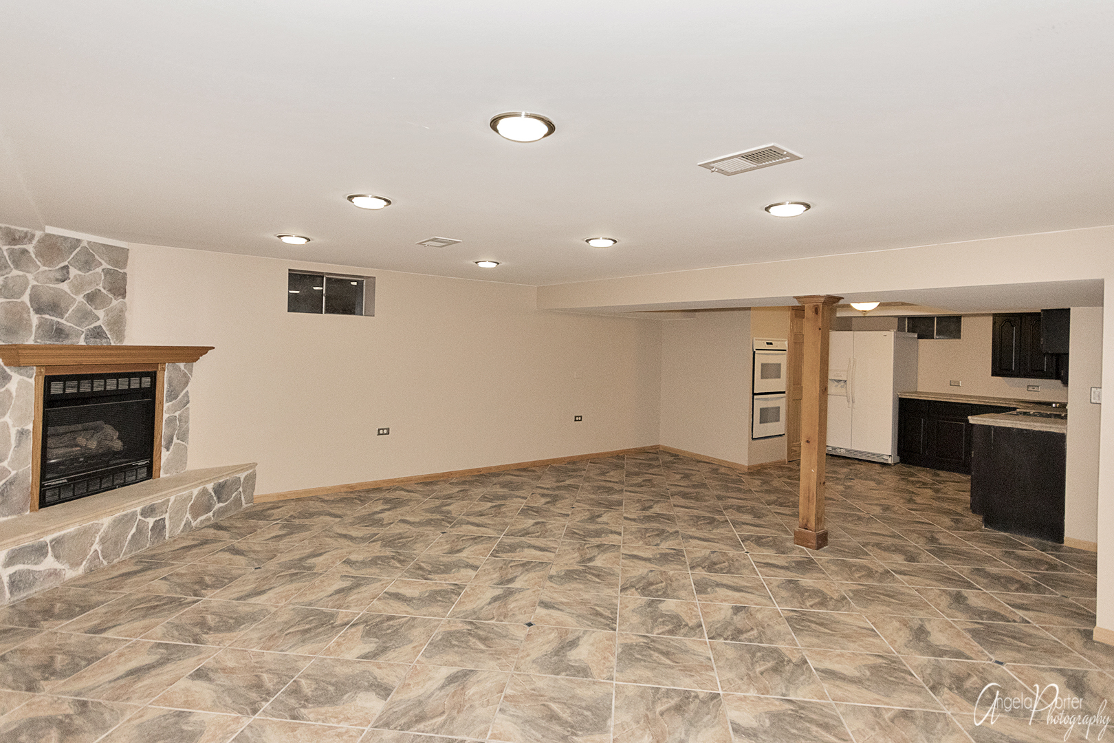 39240 North Winchester Road Wadsworth, IL 60083 - Photo 23 of 28 a view of a hall with a fireplace