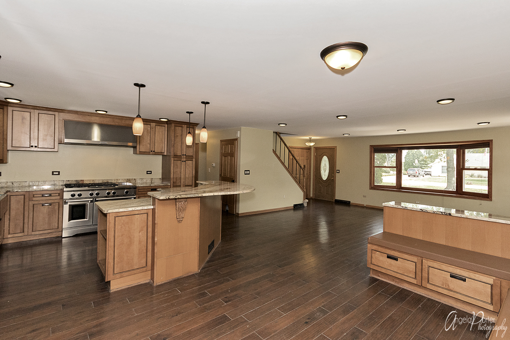 39240 North Winchester Road Wadsworth, IL 60083 - Photo 9 of 28 a kitchen with stainless steel appliances granite countertop a stove and a wooden floors