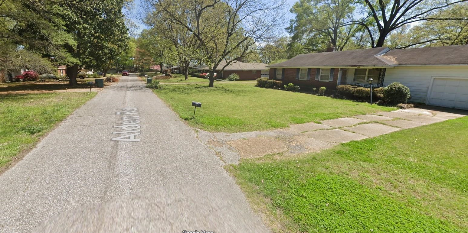 1079 Alden Road Memphis, TN 38116 - Photo 3 of 14 Single-story residential property featuring a brick and siding exterior, an attached garage, a paved driveway, and a front lawn with mature trees
