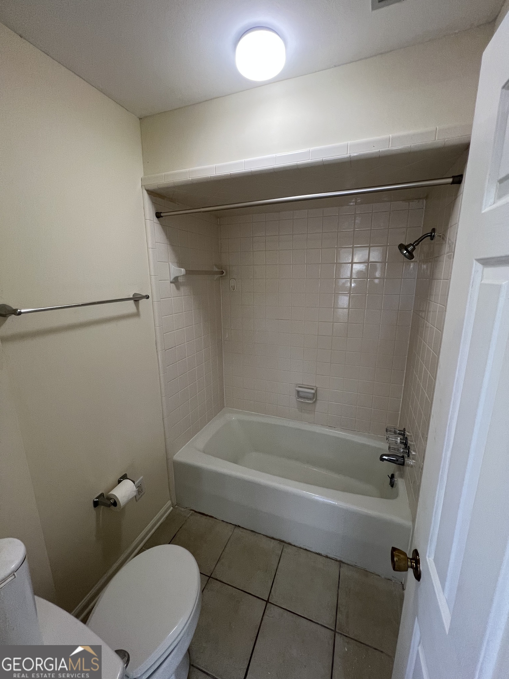 311 Fairmont Road Dublin, GA 31021 - Photo 21 of 33 a bathroom with a toilet and a shower