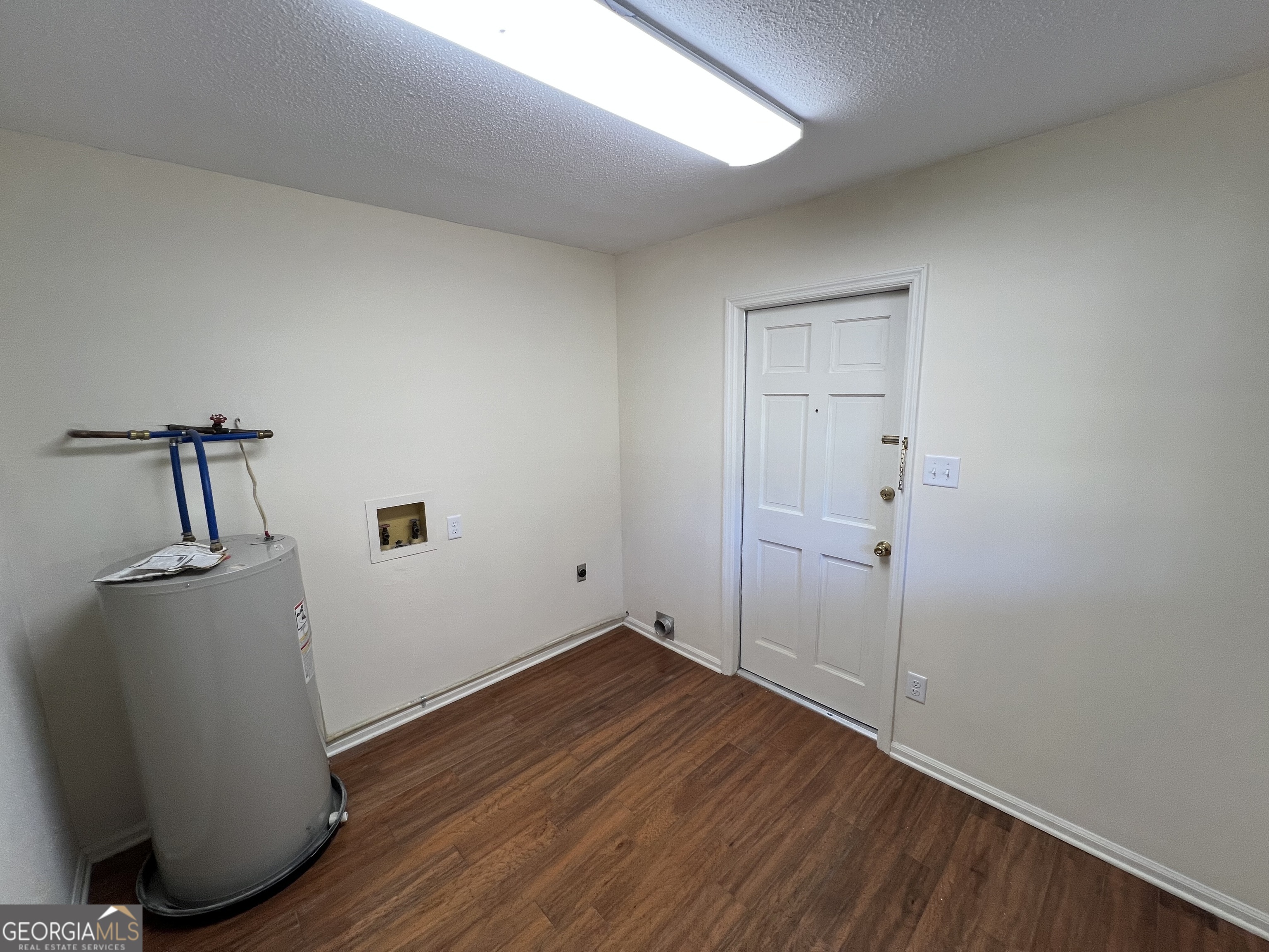 311 Fairmont Road Dublin, GA 31021 - Photo 25 of 33 a view of a room with wooden floor and cabinet