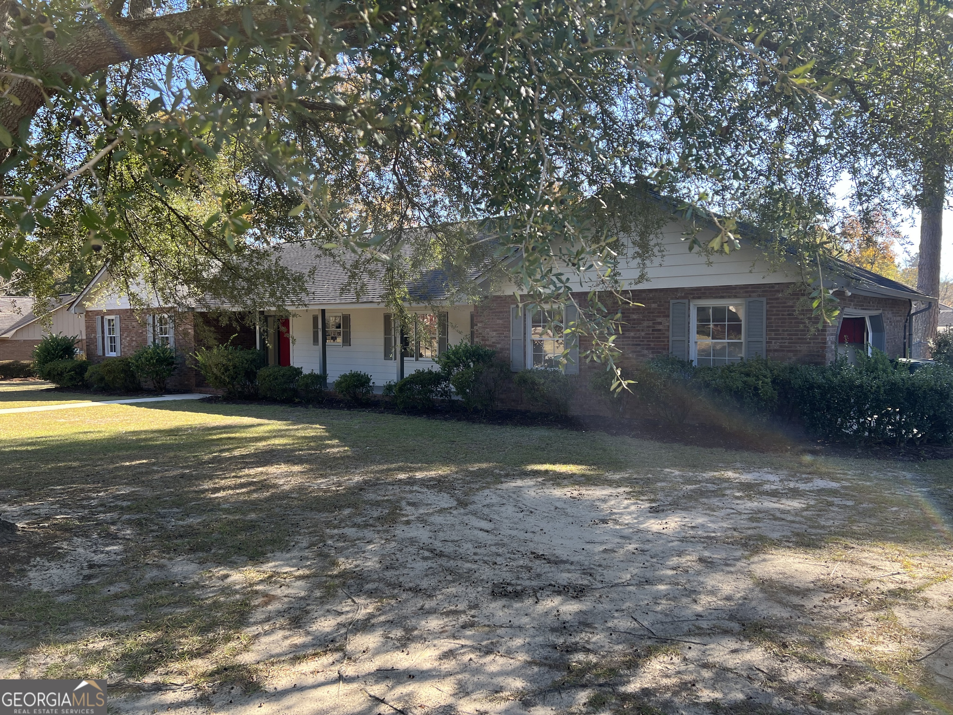 311 Fairmont Road Dublin, GA 31021 - Photo 26 of 33 a view of a house with a yard