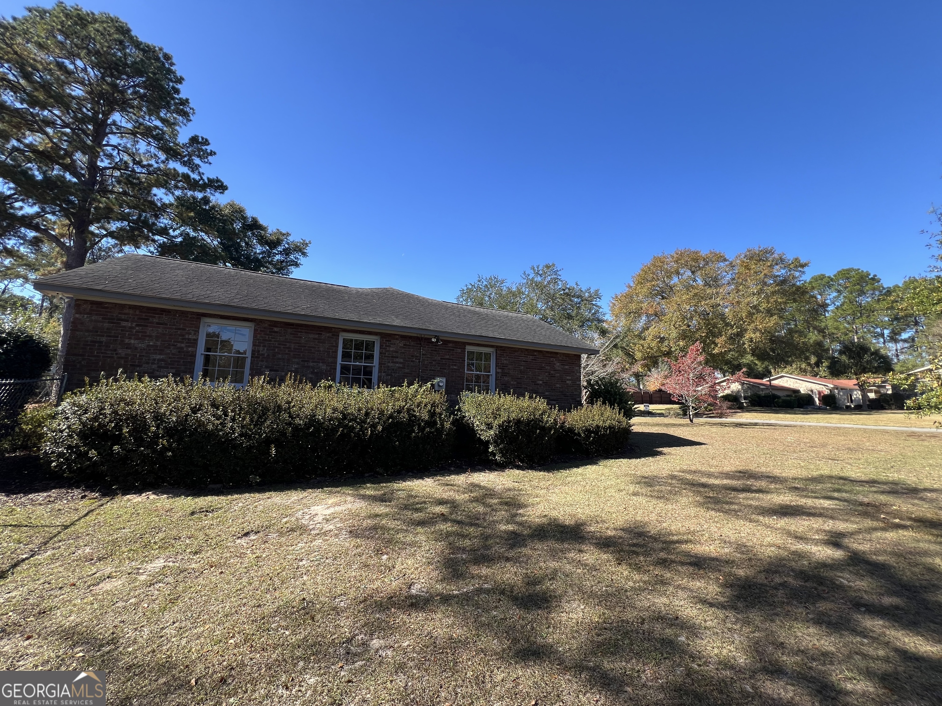 311 Fairmont Road Dublin, GA 31021 - Photo 29 of 33 a front view of a house with a yard