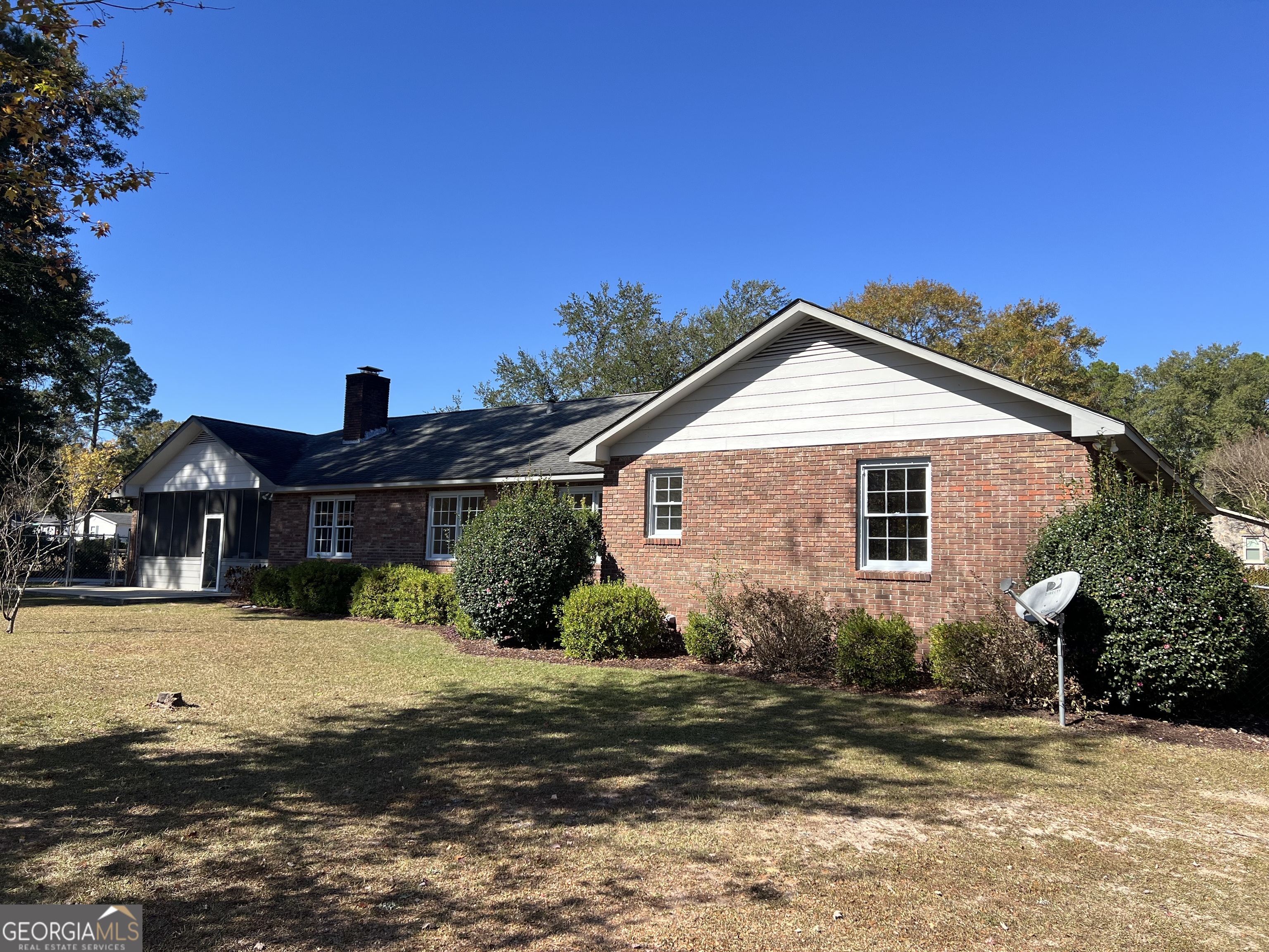 311 Fairmont Road Dublin, GA 31021 - Photo 30 of 33 a front view of a house with a yard