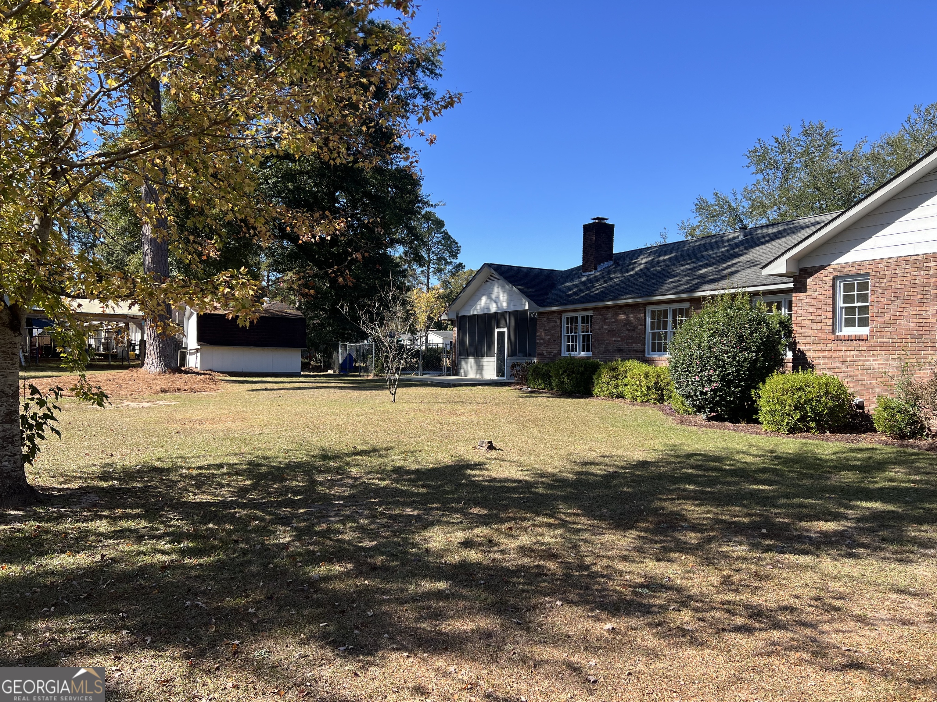 311 Fairmont Road Dublin, GA 31021 - Photo 31 of 33 a view of large house with a yard