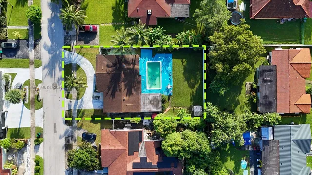 an aerial view of a house with a garden