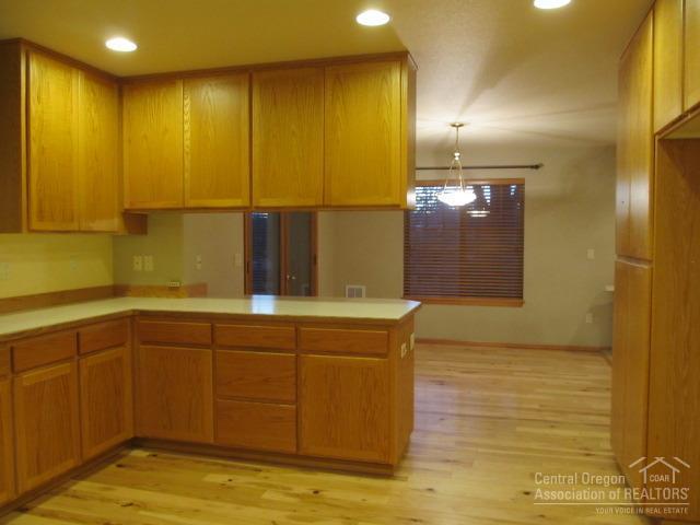 21626 Northeast Butler Market Road Bend, OR 97701 - Photo 8 of 23 a bathroom with a sink and a mirror
