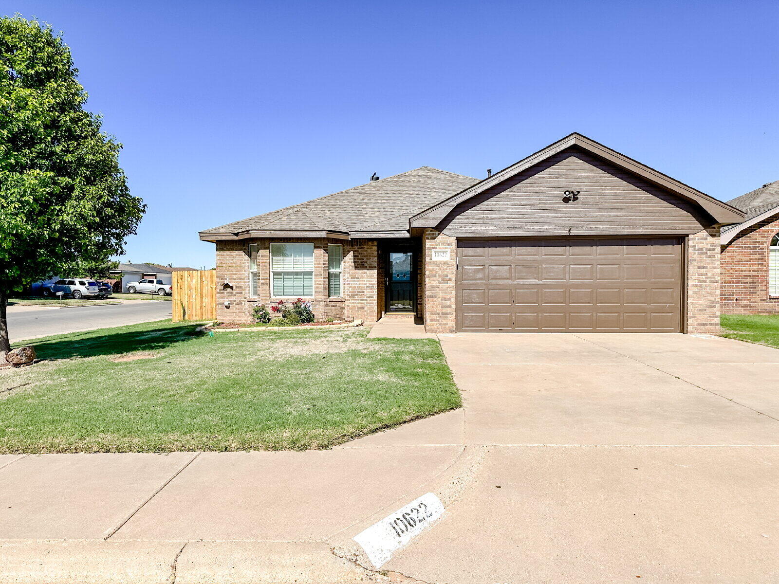 10622 Boston Avenue Lubbock, TX 79423 - Photo 1 of 28 a front view of a house with a yard