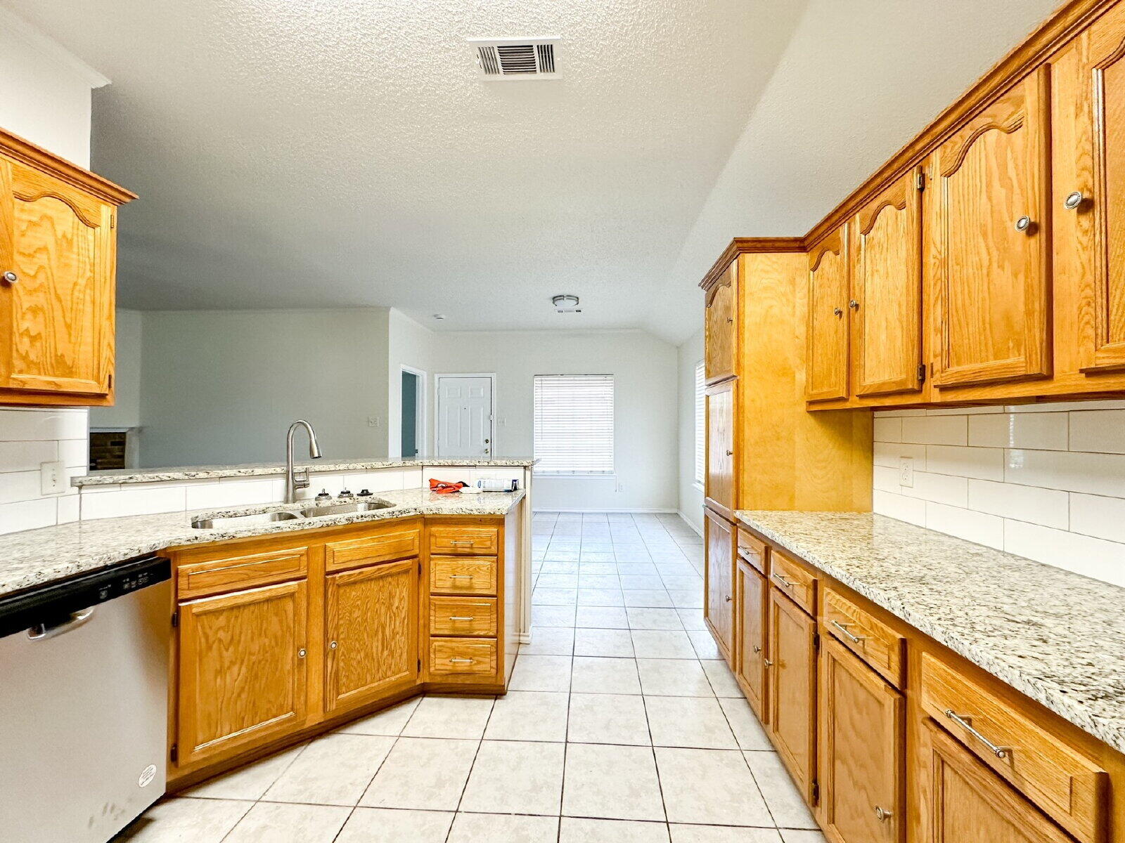 10622 Boston Avenue Lubbock, TX 79423 - Photo 12 of 28 a kitchen with a sink stove and cabinets