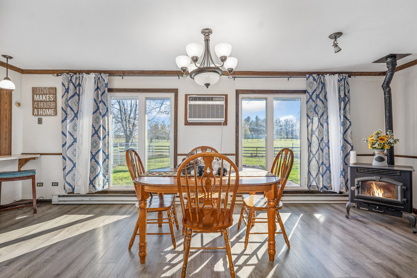 3541 East Danne Road Crete, IL 60417 - Photo 21 of 41 a view of a dining room with furniture a chandelier and wooden floor