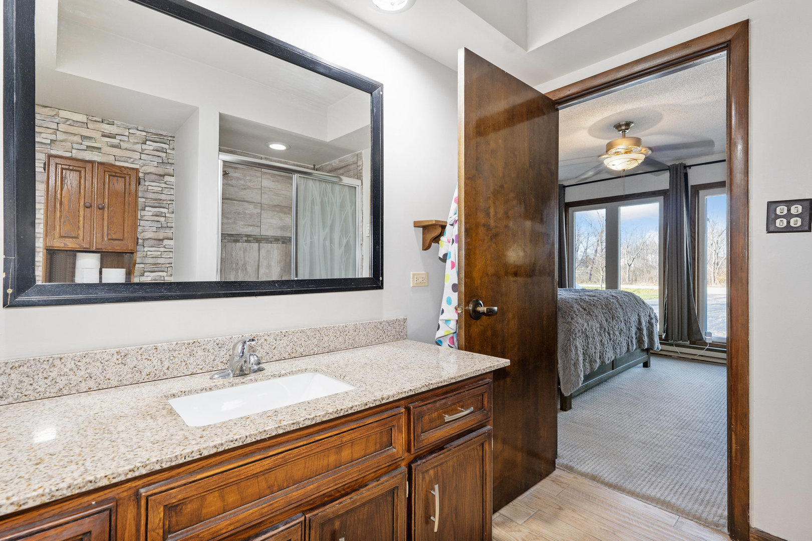 3541 East Danne Road Crete, IL 60417 - Photo 26 of 41 a en suite bathroom with a granite countertop sink and a mirror