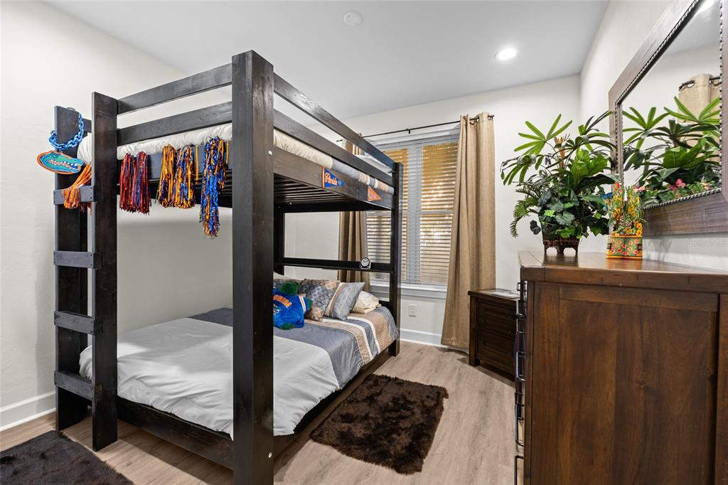 127 Northeast 3rd Street Gainesville, FL 32601 - Photo 14 of 30 a bed room with a bed and a window