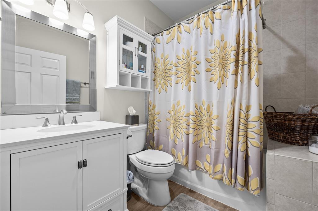 127 Northeast 3rd Street Gainesville, FL 32601 - Photo 16 of 30 a bathroom with a sink toilet and shower