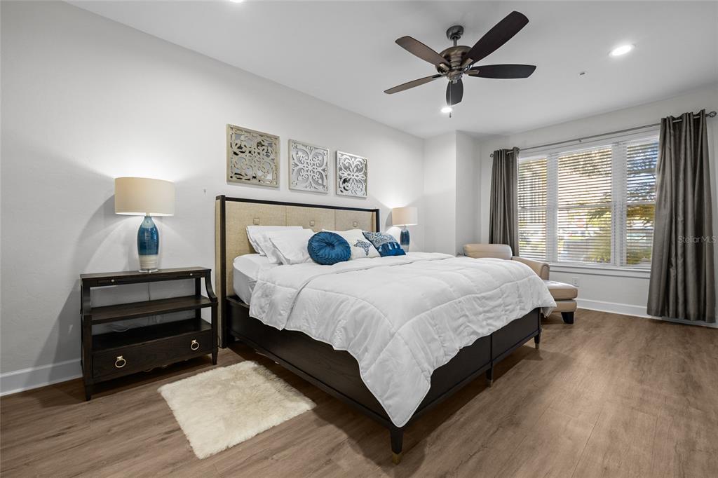 127 Northeast 3rd Street Gainesville, FL 32601 - Photo 17 of 30 a bedroom with a bed and a large window