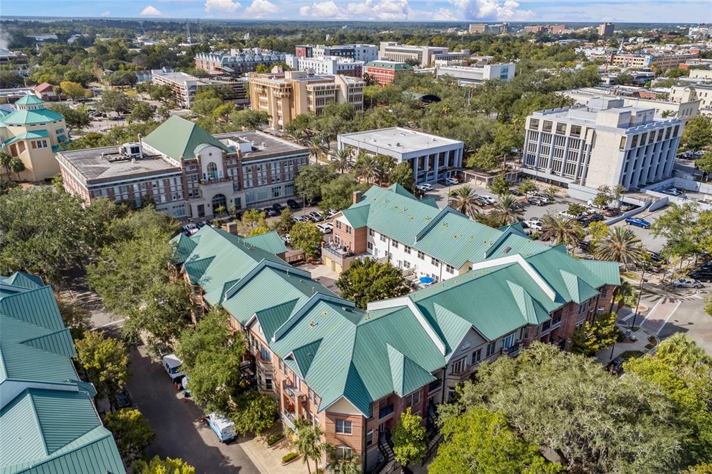 127 Northeast 3rd Street Gainesville, FL 32601 - Photo 26 of 30 an aerial view of a city with lots of residential buildings ocean and mountain view in back