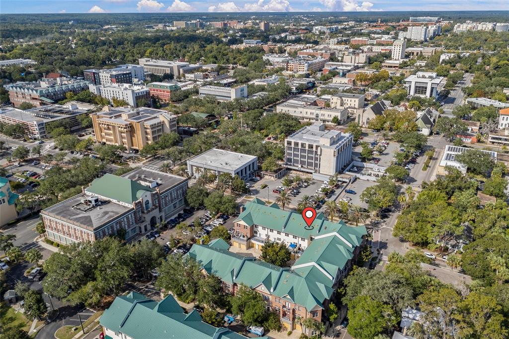 127 Northeast 3rd Street Gainesville, FL 32601 - Photo 27 of 30 an aerial view of residential houses with outdoor space and parking