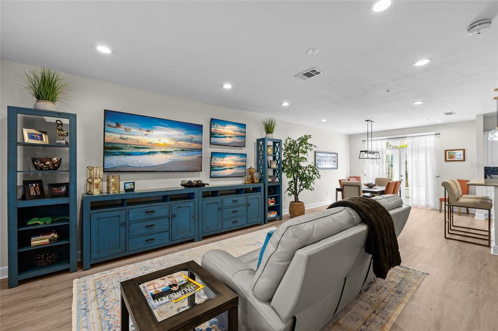 127 Northeast 3rd Street Gainesville, FL 32601 - Photo 3 of 30 a living room with furniture and a flat screen tv